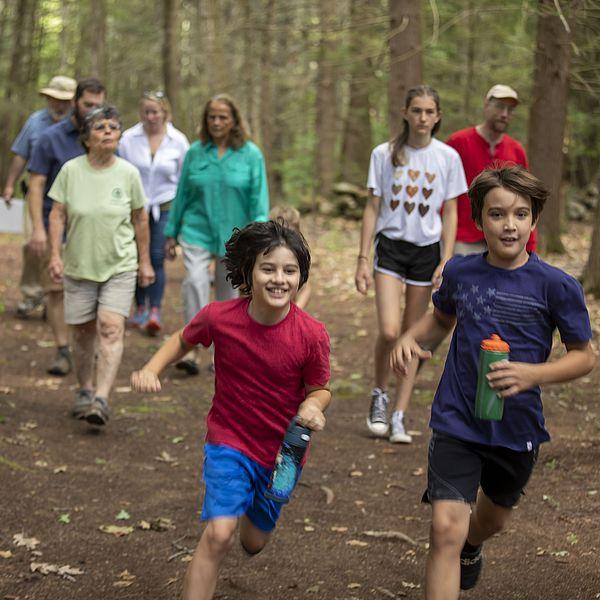 children running in the woods